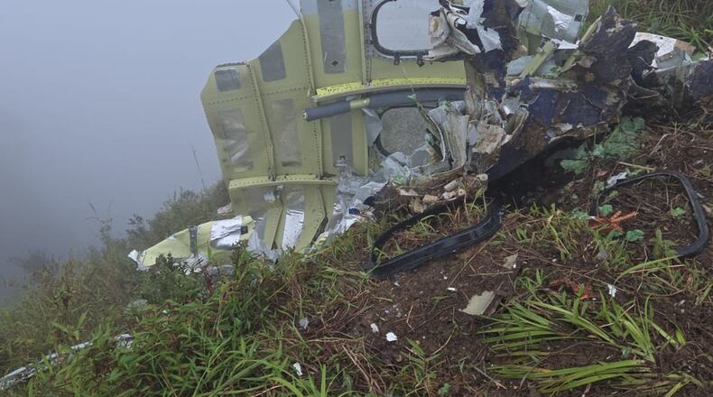 This photo provided by the Indonesian National Search and Rescue Agency (BASARNAS) shows debris of an ATR 42-500 turboprop airplane at Mount Bulusaraung in South Sulawesi province, Indonesia, Sunday, Jan. 18, 2026, after the aircraft lost contact Saturday. (BASARNAS via AP)