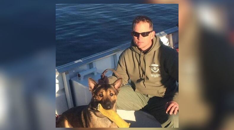 Houston County sheriff's Sgt. Slate Simon and Kyro. (Credit: The Telegraph)