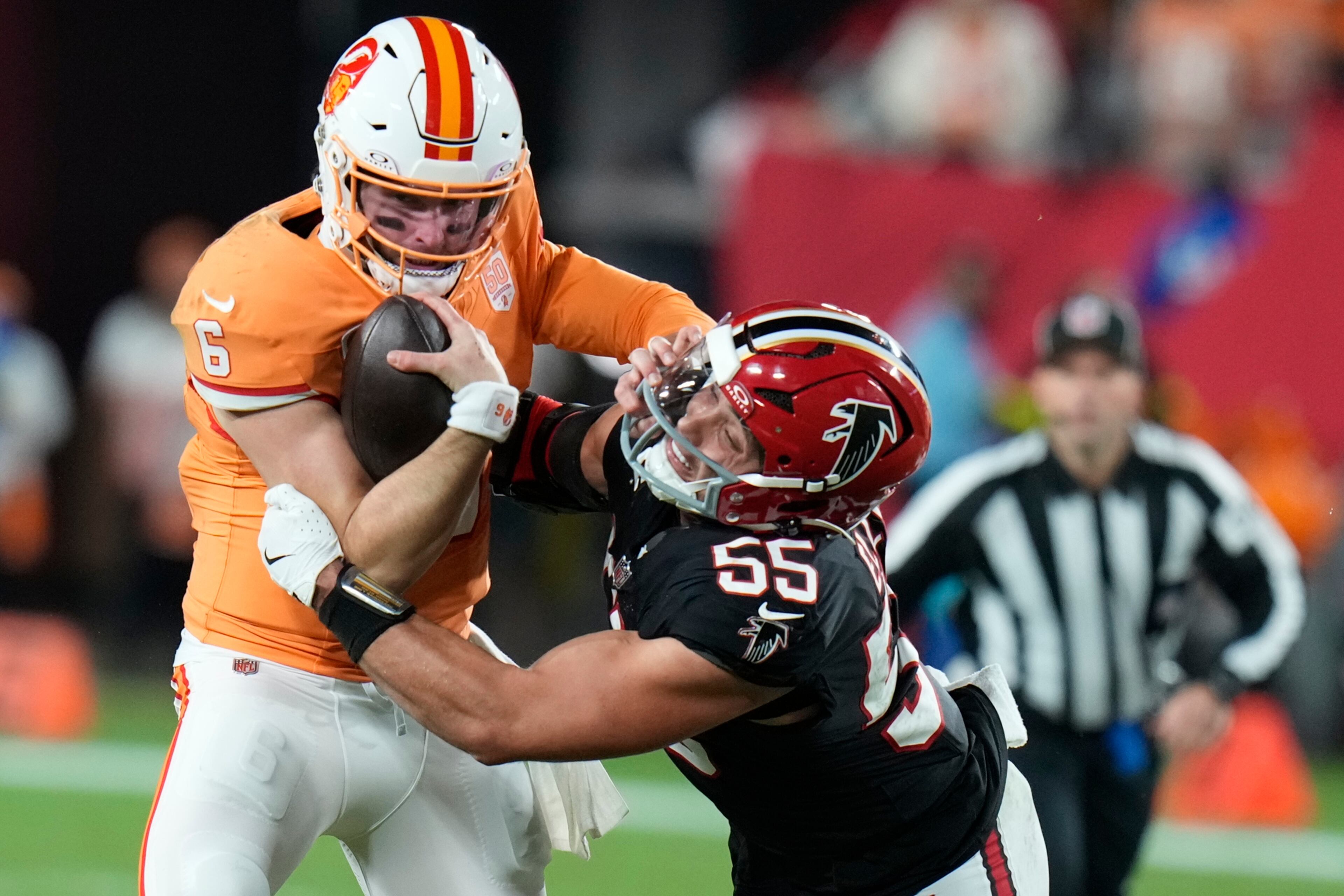 Atlanta Falcons linebacker Kaden Elliss (55) sacks Tampa Bay Buccaneers quarterback Baker Mayfield (6) during the first half of an NFL football game, Thursday, Dec. 11, 2025, in Tampa, Fla. (AP Photo/Chris O'Meara)