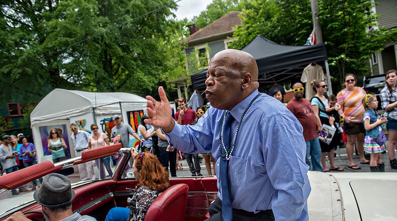 April 25, 2015 Atlanta - Congressman John Lewis blows kisses to the crowd as he rides in the parade during the Inman Park Festival in Atlanta on Saturday, April 25, 2015. The two day festival featured artists, musicians, food, a tour of homes, the parade and activities for children. JONATHAN PHILLIPS / SPECIAL
