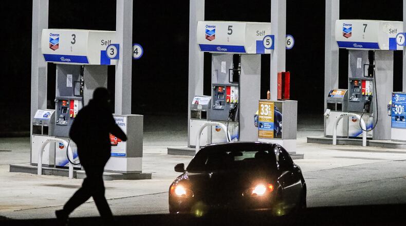 A woman was shot and killed early Friday during an attempted robbery at this Chevron Food Mart on Redan Road in DeKalb County. JOHN SPINK / JSPINK@AJC.COM.