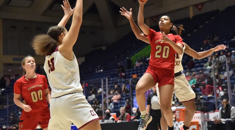 March 12, 2021 Macon - Greater Atlanta Christian's Kaleigh Addie (20) gets off a shot over Cross Creek's Jenna Wilbon (50) during the 2021 GHSA State Basketball Class AAA Girls Championship game at the Macon Centreplex in Macon on Friday, March 12, 2021 Cross Creek won 56-44 over Greater Atlanta Christian. (Hyosub Shin / Hyosub.Shin@ajc.com)