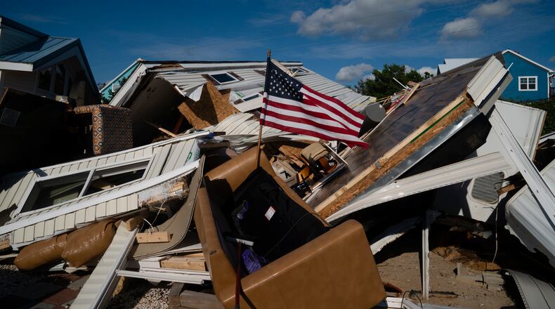 An American flag flies amid tornado damage associated with Hurricane Dorian at the Boardwalk RV Park the day after Hurricane Dorian passed through the area on Sept. 6, in Emerald Isle, N.C.. .Every month, about 15 members from disaster response ministry at Alpharetta First United Methodist Church travel to Southeast towns devastated by tornadoes or hurricanes to help with clean-up. MUST CREDIT: Photo for The Washington Post by Elijah Nouvelage
Photo by: Elijah Nouvelage For The Washington Post.