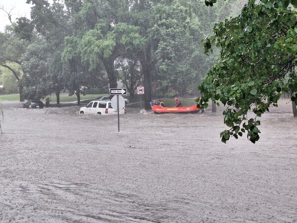 This photo provided by Colin Fee, a vehicle is surrounded by flood waters as heavy rains caused flash flooding in the Wichita area of south-central Kansas forcing firefighters to rescue dozens of people, including stranded motorists on Tuesday, June 3, 2025. (Colin Fee via AP)