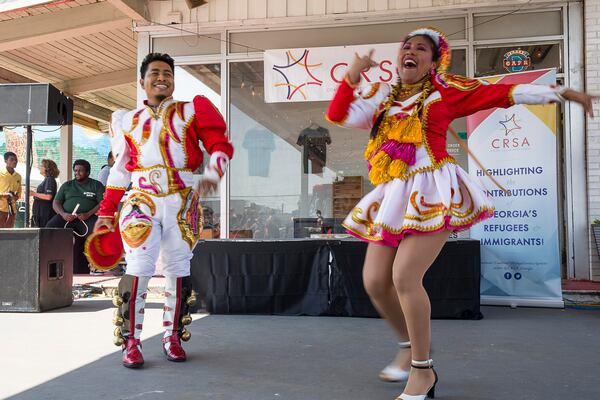 6/15/2019 -- Clarkston, Georgia -- Members of the Aklla Sumaq, a Peruvian Cultural Association, perform a dance during a World Refugee Day celebration at Refuge Coffee Company in Clarkston, Saturday, June 15, 2019. (Alyssa Pointer/alyssa.pointer@ajc.com)