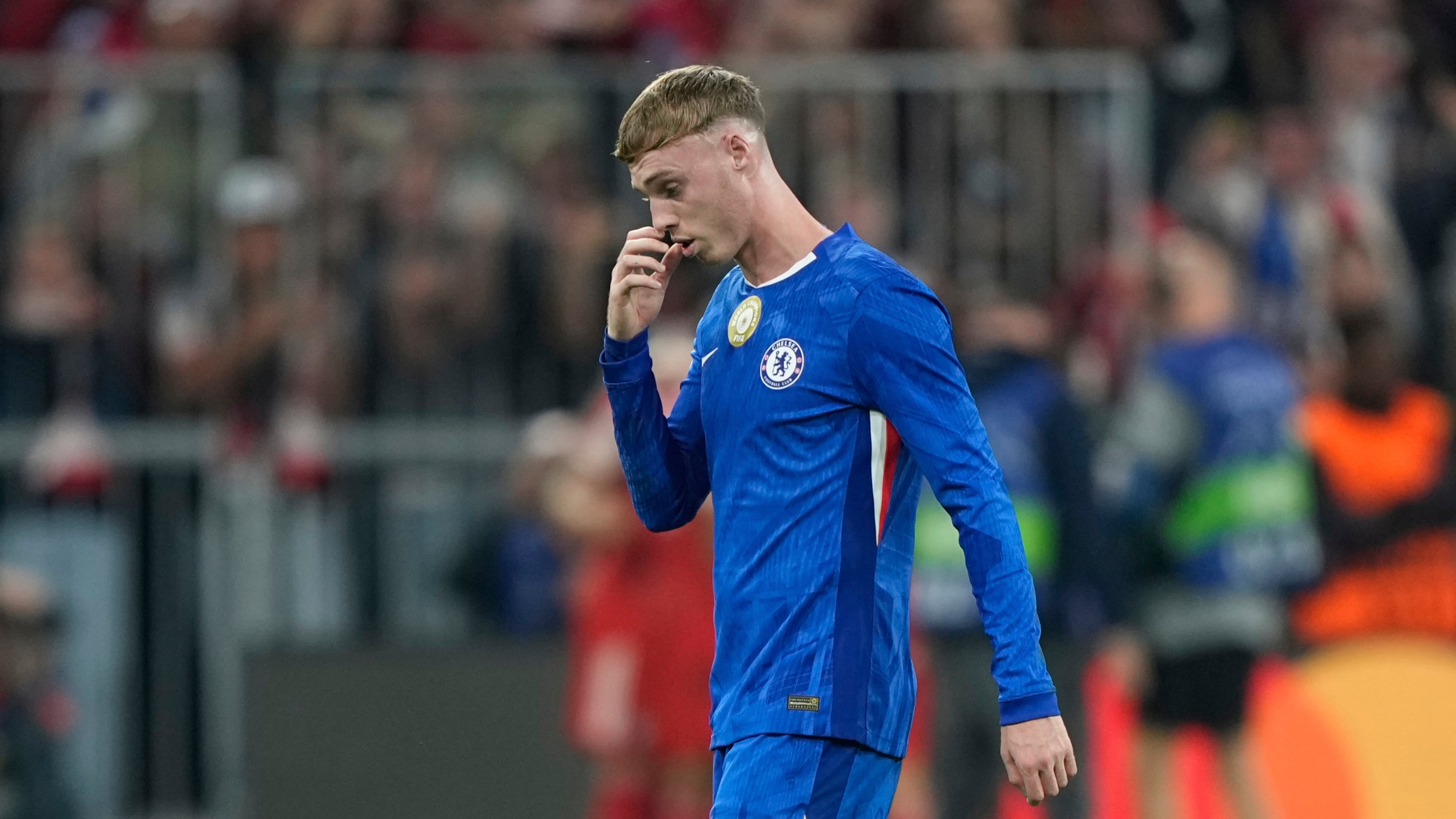 Chelsea's Cole Palmer gestures after Bayern's Harry Kane scored his side's third goal during the Champions League opening phase soccer match between FC Bayern Munich and Chelsea at the Allianz Arena in Munich, Germany, Wednesday, Sept. 17, 2025. (AP Photo/Martin Meissner)
