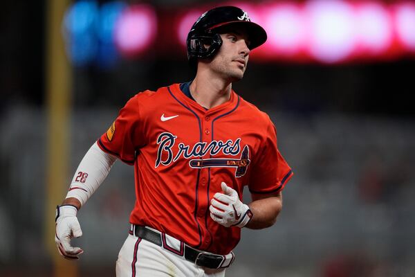 Atlanta Braves first baseman Matt Olson (28) rounds the bases after hitting a solo homer against the Los Angeles Dodgers in the seventh inning of a baseball game, Friday, May 2, 2025, in Atlanta. (AP Photo/Mike Stewart)