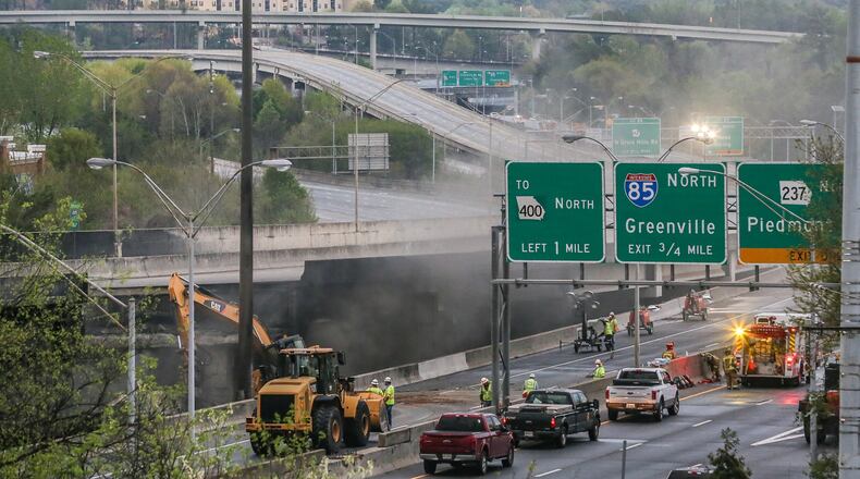 Crews work Friday March 31, 2017, on the portion of I-85 that collapsed during the Thursday evening rush hour.