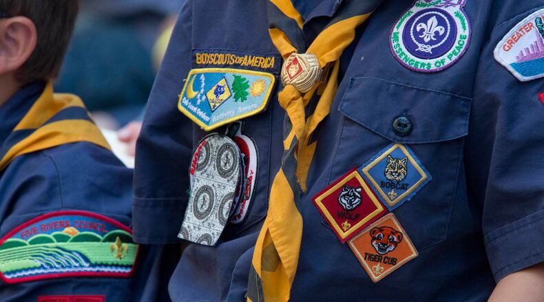 In this Saturday, June 25, 2016 photo, Cub Scouts watch a race during the Second Annual World Championship Pinewood Derby in New York's Times Square. (AP Photo/Mary Altaffer)
