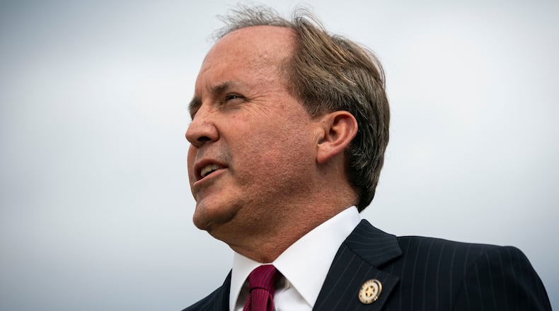 FILE -- Ken Paxton, the Texas attorney general, holds a news conference outside the Supreme Court building in Washington, Sept. 9, 2019. An architect of Texas Republicans’ aggressive conservative agenda, Paxton now stands accused of wrongdoing by his own aides and faces calls for his resignation.  (Al Drago/The New York Times) .