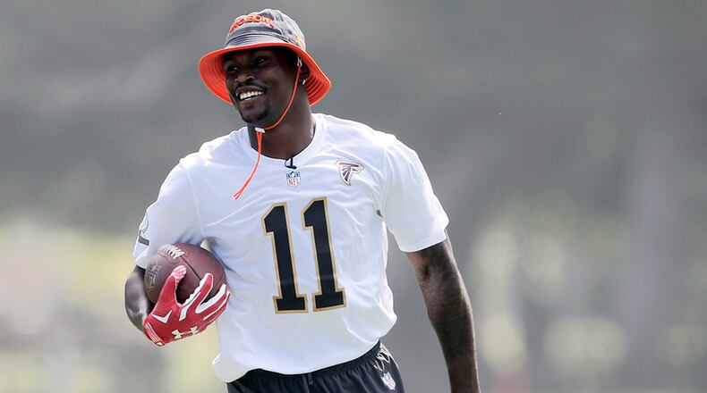 Falcons wide receiver Julio Jones carries the ball during Team Irvin's practice Thursday in Kahuku, Hawaii. (Marco Garcia/AP)
