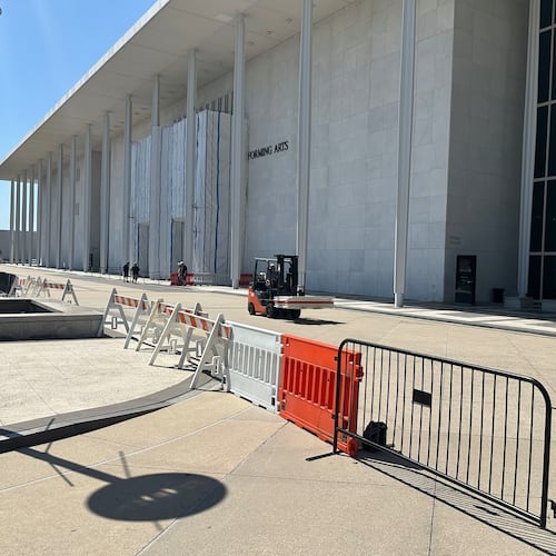 Barriers are placed outside the John F. Kennedy Center for the Performing Arts on Wednesday, Sept. 16, 2026, in Washington. (AP Photo/Nathan Ellgren)