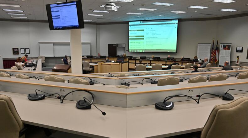 The Gwinnett County Board of Education is one of a handful of government bodies keeping its regular meeting schedule with meetings in person. Only two members of the public showed up for the meeting Thursday, March 19, 2020. HYOSUB SHIN / HYOSUB.SHIN@AJC.COM