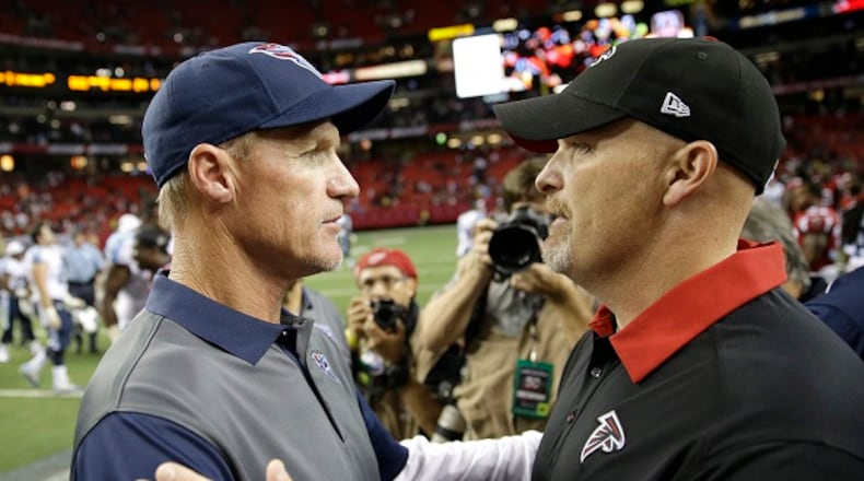 Atlanta Falcons head coach Dan Quinn, right, talks with Tennessee Titans head coach Ken Whisenhunt, left, after an NFL football preseason game, Friday, Aug. 14, 2015, in Atlanta. Atlanta won 31-24. (AP Photo/David Goldman)