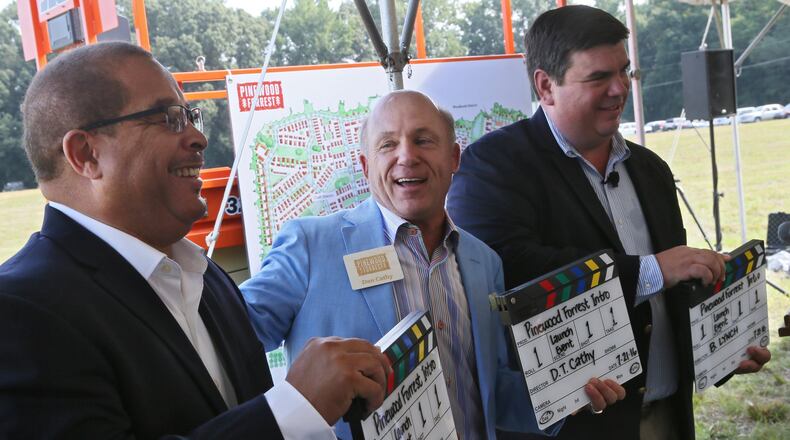 Rev. Ed Johnson (from left), Fayetteville’s mayor, Dan T. Cathy, and Bill Lynch, Pinewood Forrest Project Director, were on hand for the launch of Pinewood Forrest in July. Pinewood Forrest is a 234-acre residential and mixed-use development adjacent to Pinewood Atlanta Studios in Fayetteville, Georgia. The project will be built near the Pinewood Atlanta Studios campus. BOB ANDRES / BANDRES@AJC.COM