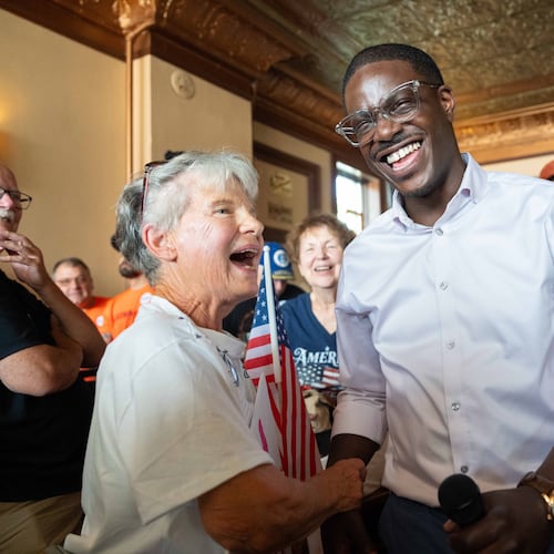 David Crowley, Democratic candidate for Wisconsin governor, shakes hands with Karen Hilt, left, during a campaign stop Friday, Aug. 7, 2026, in Sheboygan, Wis. (AP Photo/Kayla Wolf)