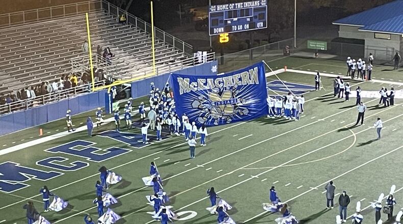 McEachern players prepare to take the field before their first-round playoff game against South Gwinnett on Nov. 12, 2021. McEachern won 34-28 in two overtime periods.
