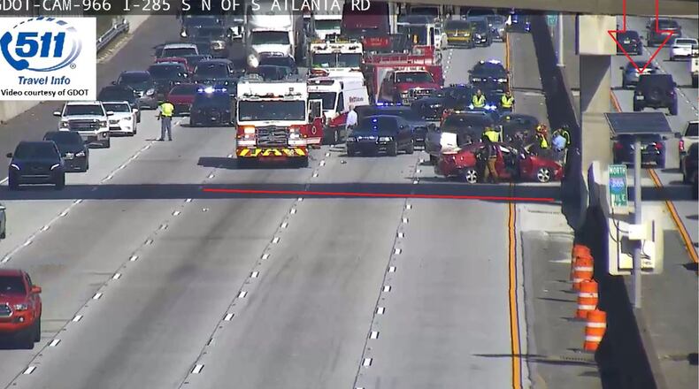 Emergency crews  temporarily shut down left lanes in both directions on I-285 at South Atlanta Road after an overturned vehicle crash Tuesday.
