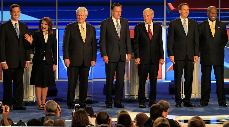 Former Pennsylvania Sen. Rick Santorum, left to right, Rep. Michele Bachmann, R-Minn., former House Speaker Newt Gingrich, former Massachusetts Gov. Mitt Romney, Rep. Ron Paul, R-Texas, former Minnesota Gov. Tim Pawlenty and businessman Herman Cain during a June 2011 presidential debate in New Hampshire. (AP/Jim Cole)
