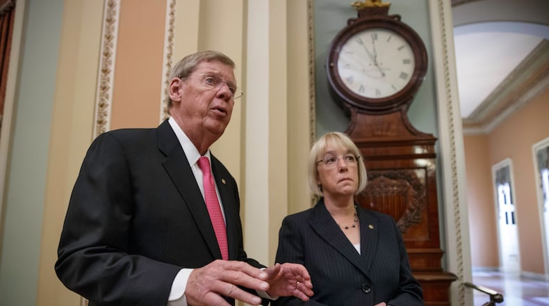 Sen. Johnny Isakson, R-Ga., left, and Sen. Patty Murray, D-Wash., meet before walking into the Senate chamber to shepherd the Workforce Innovation and Opportunity Act which aims to help job seekers gain valuable employment skills, at the Capitol in Washington, Wednesday, June 25, 2014. Sen. Isakson, a Republican, and Sen. Murray, a Democrat, praised the bipartisan effort on both sides of the Hill which would eliminate excess federal programs and overhaul requirements throughout the job training system. (AP Photo/J. Scott Applewhite) Sen. Johnny Isakson, R-Ga., left, and Sen. Patty Murray, D-Wash., in the Capitol in 2014.