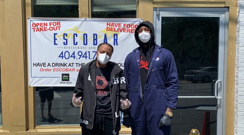 Co-owners of Escobar Lounge Mychel "Snoop" Dillard (left) and rapper 2Chainz personally helped serve meals to the homeless after deciding not to reopen their restaurant on April 27. COURTESY OF ESCOBAR LOUNGE