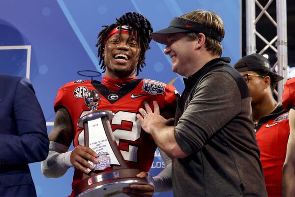 Georgia head coach Kirby Smart celebrates with defensive MVP defensive back Javon Bullard after Georgia’s 42-41 win against Ohio State in the Peach Bowl Playoff Semifinal, at Mercedes-Benz Stadium, Sat., Dec. 31, 2022, in Atlanta. Bullard was named defensive MVP of the Peach bowl, and of the championship game win over TCU. (Jason Getz / Jason.Getz@ajc.com)