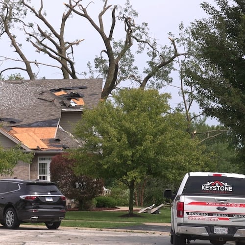 In this image made from video, a roof is damaged after a strong storm in Tinley Park, Ill., Tuesday, Aug. 11, 2026. (AP Photo/Laura Bargfeld)