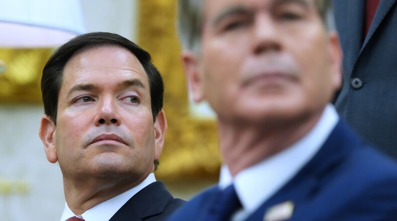 Secretary of State Marco Rubio, left, listen as President Donald Trump meets with Iraq's Prime Minister Ali al-Zaidi in the Oval Office of the White House, Tuesday, July 14, 2026, in Washington. (AP Photo/Julia Demaree Nikhinson)