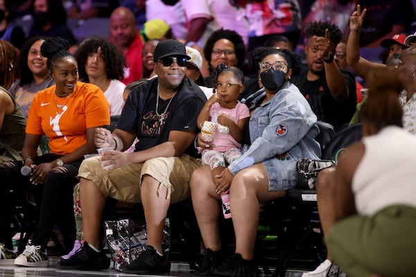 Actor and comedian Kenan Thompson, of Saturday Night Live, and his family react as he is introduced during the game between the Atlanta Dream and the Connecticut Sun at The Gateway Center at College Park, Friday, July 15, 2022, in College Park, Ga. (Jason Getz/AJC)
