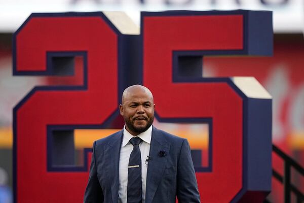 Andruw Jones walks on the field as the Braves retire his jersey number, 25, on Saturday, Sept. 9, 2023, in Atlanta. Jones collected a decade of consecutive Gold Glove honors and smashed 434 home runs. (Brynn Anderson/AP)