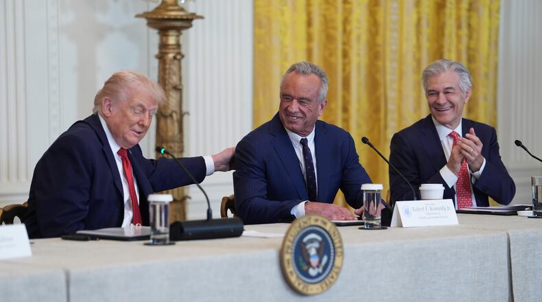 President Donald Trump attends an event to promote investment in rural health care in the East Room of the White House, Friday, Jan. 16, 2026, in Washington. Standing with the President are Secretary of Health and Human Services, Robert F. Kennedy, Jr., and Mehmet Oz, Administrator for the Centers for Medicare & Medicaid Services. (AP Photo/Evan Vucci)