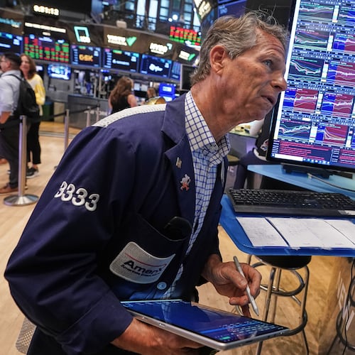 Trader Robert Charmak works on the floor of the New York Stock Exchange, Friday, June 26, 2026. (AP Photo/Richard Drew)