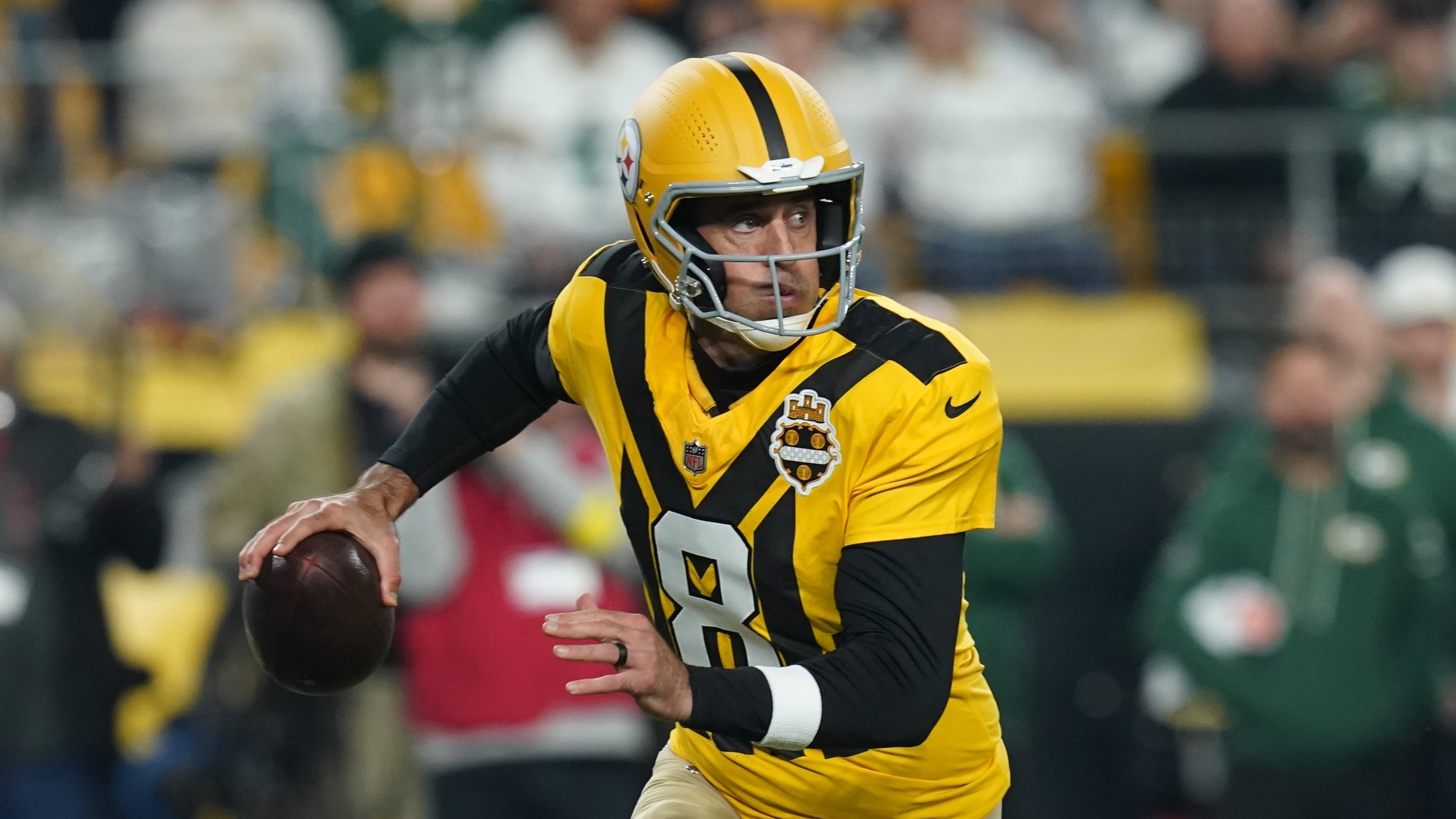 Pittsburgh Steelers' Aaron Rodgers scrambles during the first half of an NFL football game against the Green Bay Packers Sunday, Oct. 26, 2025, in Pittsburgh. (AP Photo/Matt Freed)
