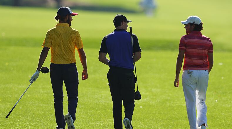 Rory McIlroy (center) plays a Masters practice round with amateurs Curtis Luck (left) and Toto Gana making their way down the seventh fairway at Augusta National Golf Club on Tuesday, April 4, 2017, in Augusta. Curtis Compton/ccompton@ajc.com
