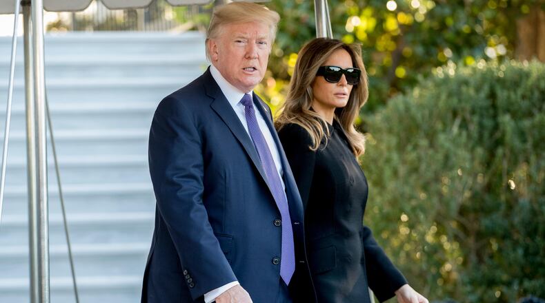 President Donald Trump and first lady Melania Trump walk toward Marine One on the South Lawn of the White House in Washington, Wednesday, Oct. 4, 2017, for a short trip to Andrews Air Force Base, Md., and then on to Las Vegas to visit with victims and first responders affected by the worst mass shooting in American history. (AP Photo/Andrew Harnik)