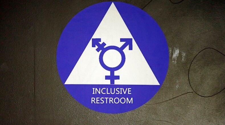 A new sticker designates a gender neutral bathroom at Nathan Hale high school Tuesday, May 17, 2016, in Seattle. President Obama’s directive ordering schools to accommodate transgender students has been controversial in some places but since 2012 Seattle has mandated that transgender students be able to use of the bathrooms and locker rooms of their choice. Nearly half of the district’s 15 high schools already have gender neutral bathrooms and one high school has had a transgender bathroom for 20 years. (AP Photo/Elaine Thompson)