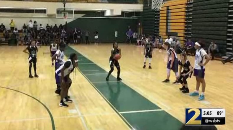 A screenshot of a video that allegedly shows the moments before a brawl broke out at this girls basketball game.