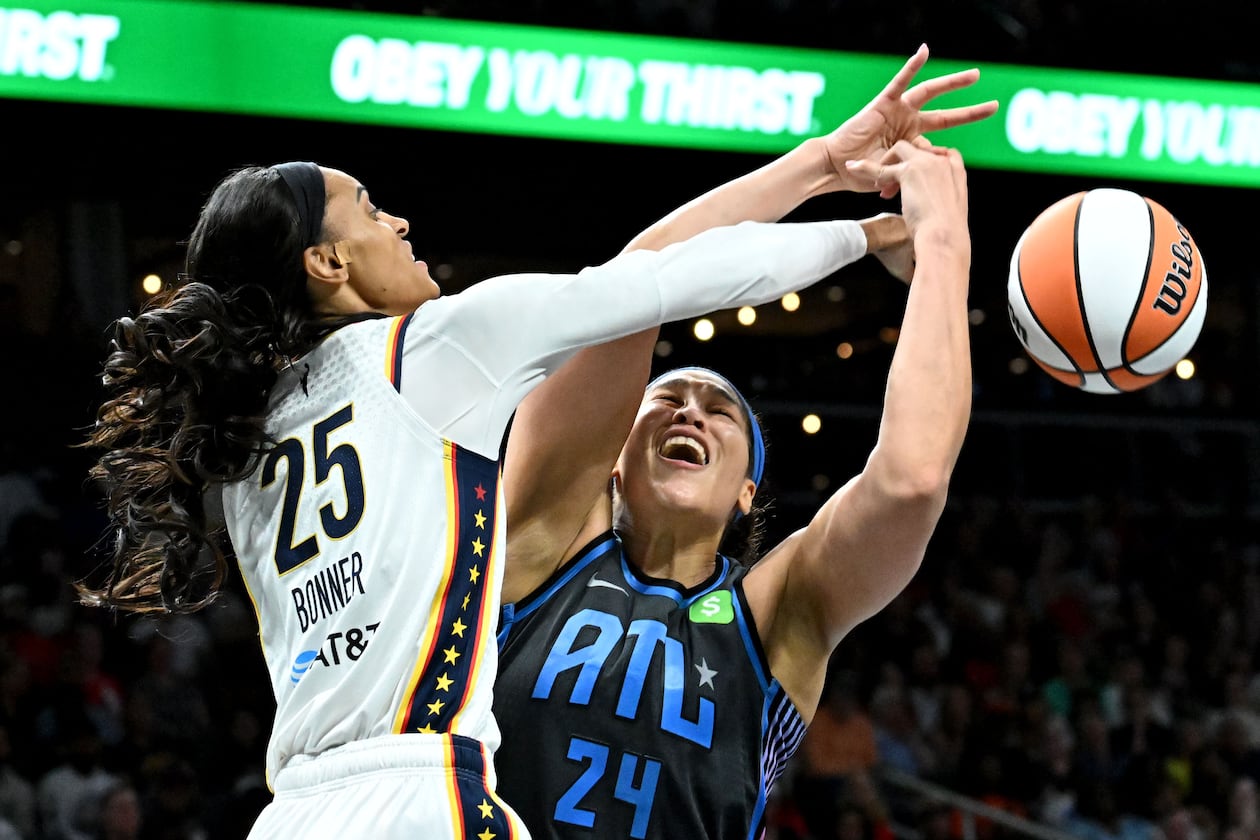 Atlanta Dream forward Brionna Jones fights for a rebound against Indiana Fever forward DeWanna Bonner during the second half in the Dream’s home opener at State Farm Arena, Thursday, May 22, 2025. (Hyosub Shin/AJC)