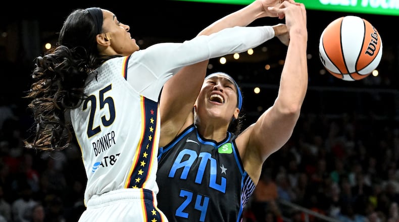 Atlanta Dream forward Brionna Jones fights for a rebound against Indiana Fever forward DeWanna Bonner during the second half in the Dream’s home opener at State Farm Arena, Thursday, May 22, 2025. (Hyosub Shin/AJC)