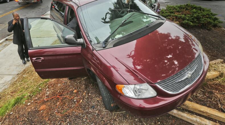 DeKalb County police search a stolen van that crashed Thursday after officers say a man tried to avoid a roadblock.