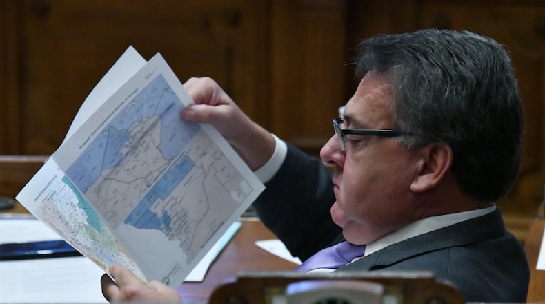 November 19, 2021 Atlanta - Sen. Steve Gooch (R-Dahlonega) looks thru the newly-drawn congressional maps in the Senate Chambers during a special session at the Georgia State Capitol in Atlanta on Friday, November 19, 2021. (Hyosub Shin/hyosub.shin@ajc.com)