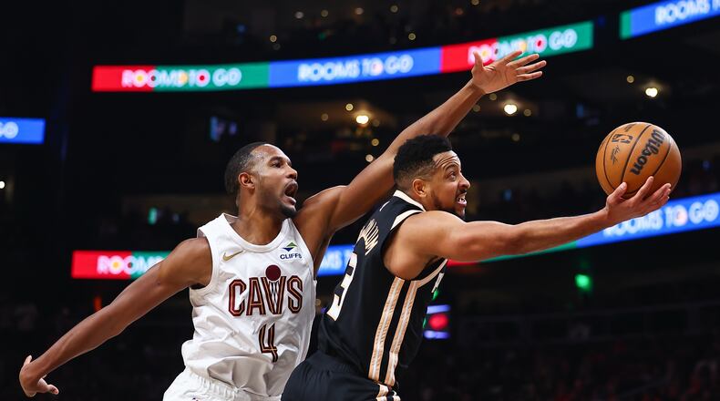 Atlanta Hawks guard CJ McCollum (right) shoots against Cleveland Cavaliers center Evan Mobley during the second half of an NBA basketball game, Friday, April 10, 2026, in Atlanta. (Colin Hubbard/AP)