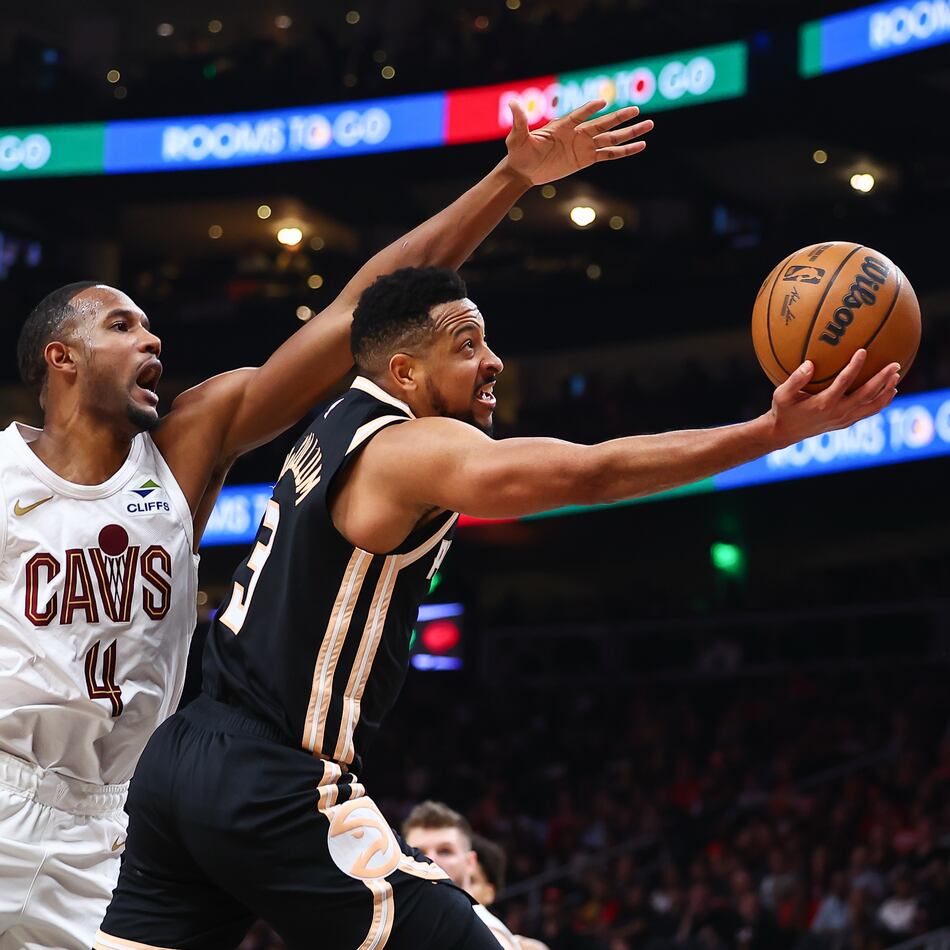 Atlanta Hawks guard CJ McCollum (right) shoots against Cleveland Cavaliers center Evan Mobley during the second half of an NBA basketball game, Friday, April 10, 2026, in Atlanta. (Colin Hubbard/AP)