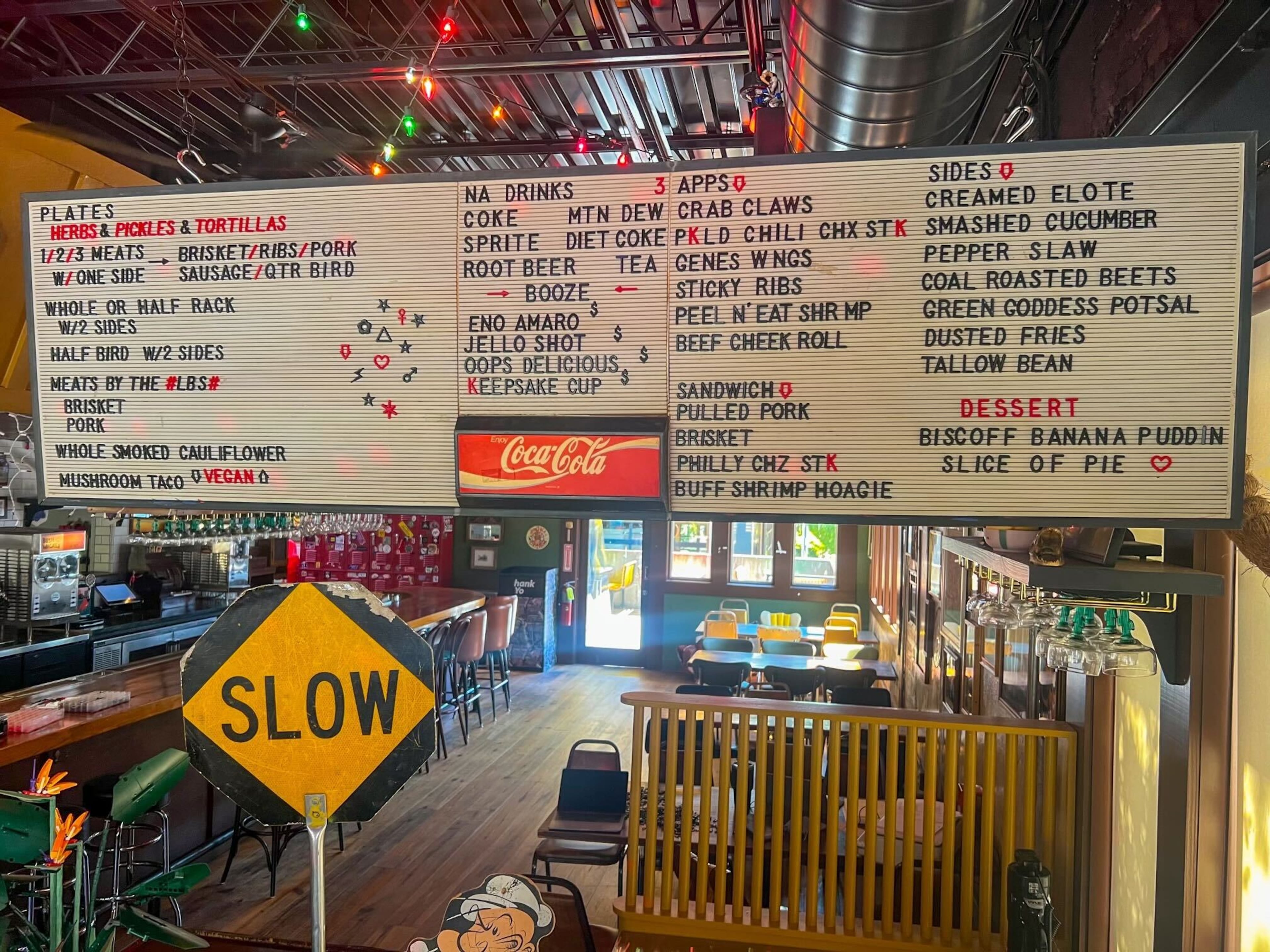 The decor at Gene's in Atlanta's East Lake neighborhood includes Christmas lights and an old-style menu board. (Courtesy of Gene's)