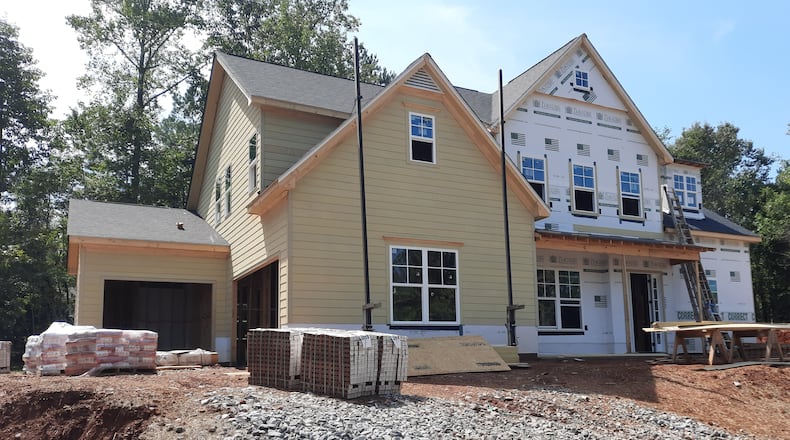 With so few homeowners listing their houses for sale, new houses are often the best bet for first-time buyers, experts say. Here's a home under construction in Cumming by Peachtree Residential.