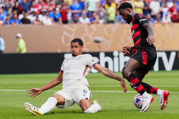 Flamengo's Gerson fakes Chelsea's Levi Colwill during the Club World Cup Group D soccer match between Flamengo and Chelsea in Philadelphia, Friday, June 20, 2025. (AP Photo/Derik Hamilton)