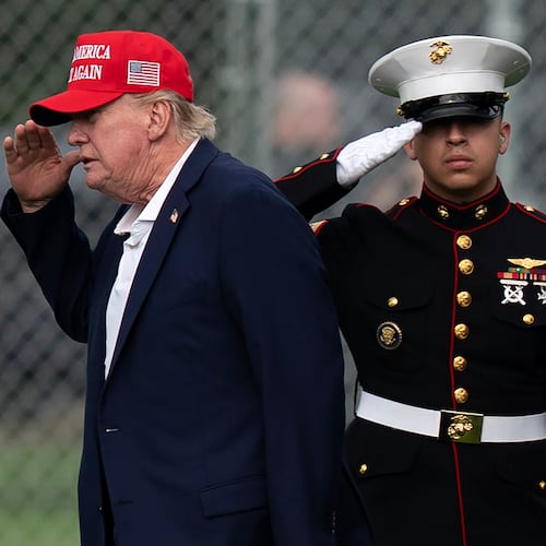 President Donald Trump returns a salute as he walks from Marine One to his limousine upon his arrival at the Ellipse just outside of the White House, Sunday, Aug. 16, 2026, in Washington. (AP Photo/Jose Luis Magana)