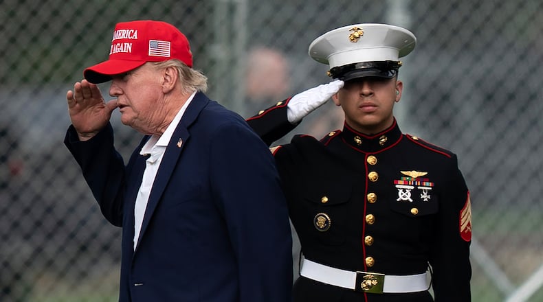 President Donald Trump returns a salute as he walks from Marine One to his limousine upon his arrival at the Ellipse just outside of the White House, Sunday, Aug. 16, 2026, in Washington. (AP Photo/Jose Luis Magana)
