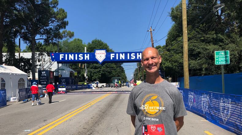 Glenn Bryant of Gainesville was the apparent final person to cross the finish line at the AJC Peachtree Road Race on July 4, 2021. (AJC photo by Ken Sugiura)