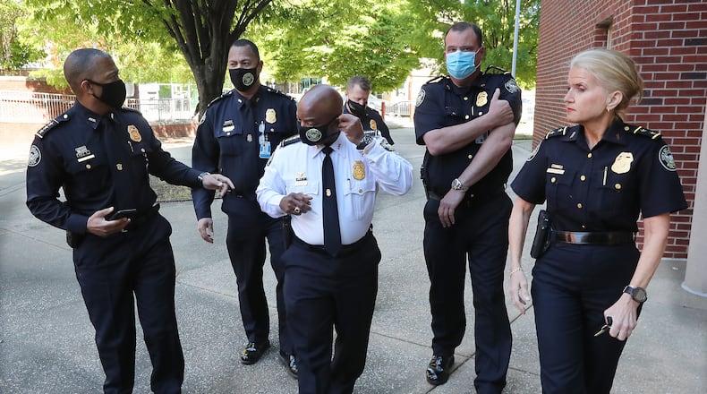 Atlanta Police Department Interim Chief Rodney Bryant (center) concludes a press conference on preparations in Atlanta on Monday. (Curtis Compton / Curtis.Compton@ajc.com)